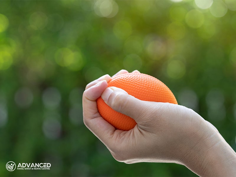 A woman's hand holding a stress ball