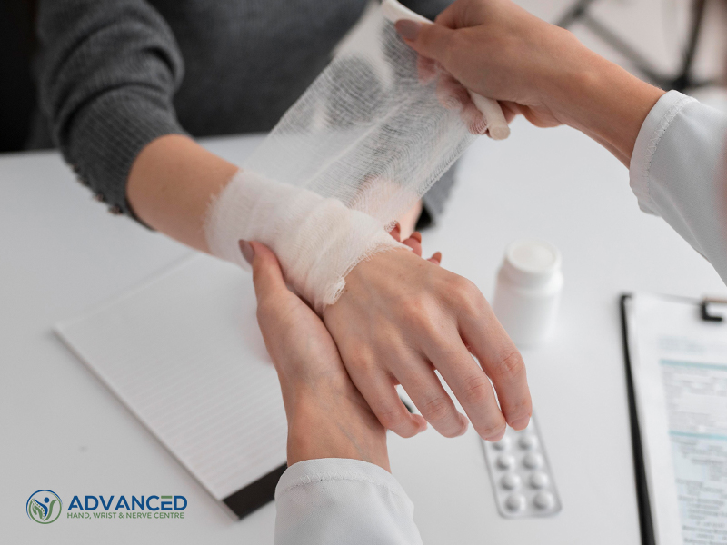 Hand surgeon wrapping hand with a bandage