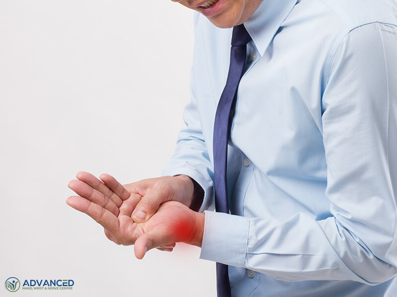 Man suffering from thumb arthritis