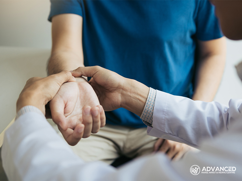 Physical Therapist Checks The Patient Wrist 