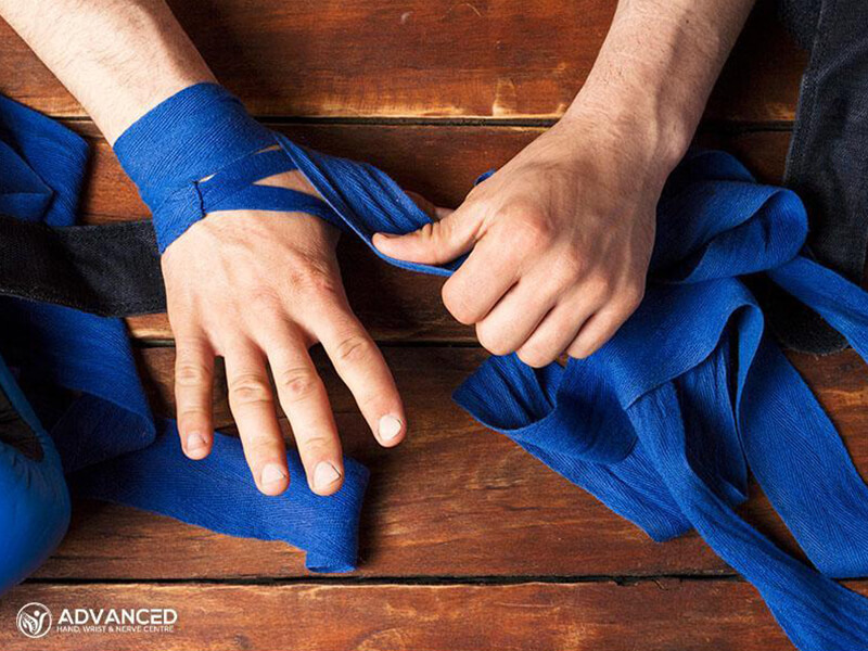 thumb sprains with blue bandage