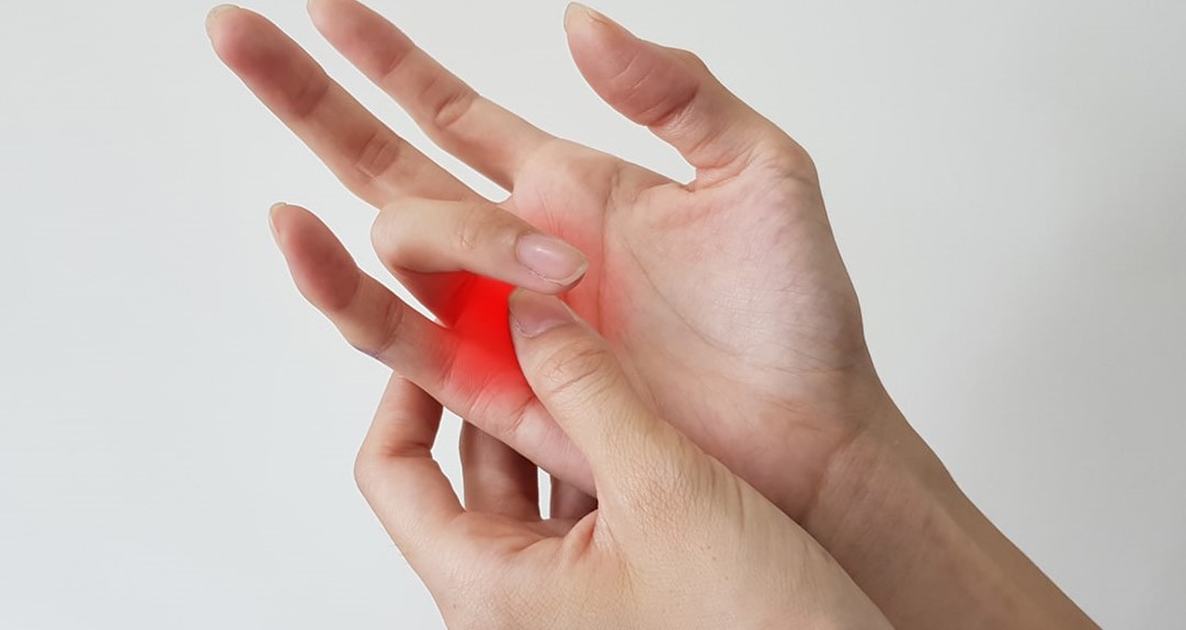 image of someone experiencing Trigger Finger pain in Singapore
