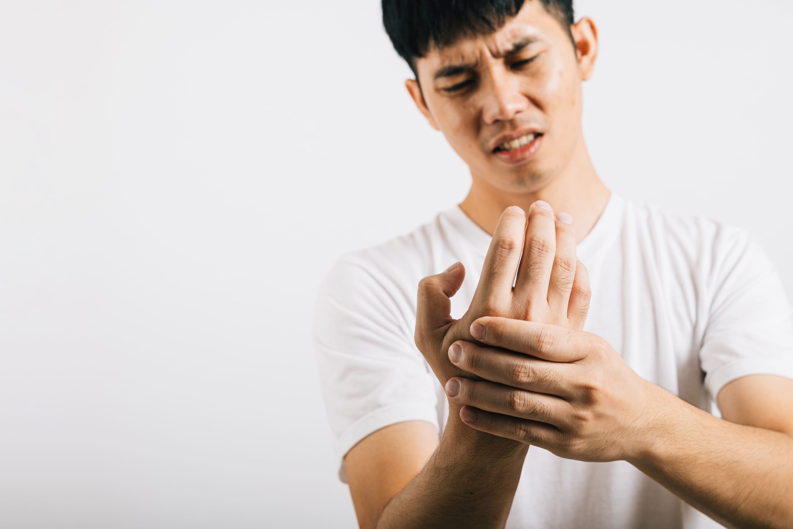 Image portrait of an asian young man suffering from hand 2025 03 09 13 11 43 utc